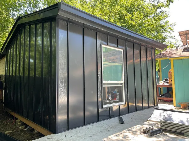 Black standing seam metal wall panels for Roof Inspection in Corsicana