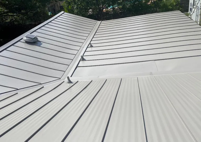 Solar attic fan installed on a metal roof for Roof Ventilation in Corsicana